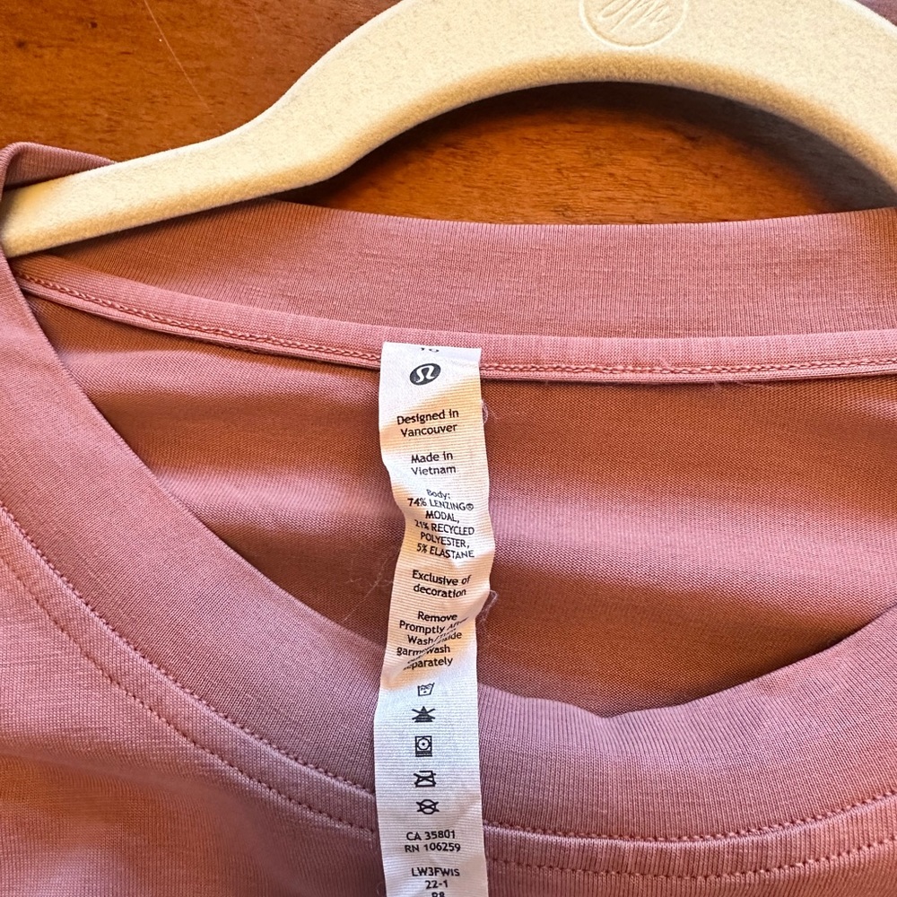 Lululemon long sleeve t-shirt. Plum color with tie. Worn once.
